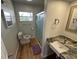 Updated bathroom featuring a sleek glass shower, modern vanity with a granite countertop, and new toilet at 6047 67Th N Ave, Pinellas Park, FL 33781