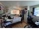 Bedroom with a queen-sized bed, an American flag, and a desk area at 6047 67Th N Ave, Pinellas Park, FL 33781