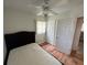This bedroom offers a bed, wood floors, and closet space at 6047 67Th N Ave, Pinellas Park, FL 33781