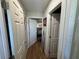 Hallway with light-colored wood floors and doors leading to other rooms in the home at 6047 67Th N Ave, Pinellas Park, FL 33781