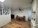 This combined kitchen and dining area features updated cabinets and wood flooring at 6047 67Th N Ave, Pinellas Park, FL 33781