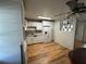 Updated kitchen features stainless appliances, new cabinets, and wood-look floors at 6047 67Th N Ave, Pinellas Park, FL 33781