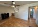 Bright living room with sleek laminate floors leading to the dining room and an adjacent bathroom at 6047 67Th N Ave, Pinellas Park, FL 33781