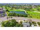 Beautiful aerial view of a golf course community featuring mature trees and a peaceful pond at 6207 Gulfport S Blvd, Gulfport, FL 33707