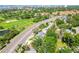 Community aerial view showcases neighborhood homes along golf course and main road at 6207 Gulfport S Blvd, Gulfport, FL 33707