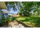 Backyard showcasing a stone patio and lush lawn, perfect for entertaining at 6207 Gulfport S Blvd, Gulfport, FL 33707