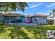 Outdoor patio with a dining table and seating, providing a comfortable space for al fresco dining and relaxation at 6207 Gulfport S Blvd, Gulfport, FL 33707