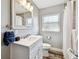 Well-lit bathroom features a white vanity, modern fixtures, and stylish mirror at 6207 Gulfport S Blvd, Gulfport, FL 33707