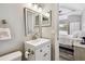 Cozy bathroom with a vanity sink with access to the bedroom at 6207 Gulfport S Blvd, Gulfport, FL 33707