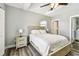 Bright bedroom with a ceiling fan and ensuite bathroom at 6207 Gulfport S Blvd, Gulfport, FL 33707