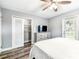 Bright bedroom with closet, door to yard, and hardwood style floors at 6207 Gulfport S Blvd, Gulfport, FL 33707