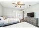 Bright bedroom features two beds, closet, and bathroom access at 6207 Gulfport S Blvd, Gulfport, FL 33707
