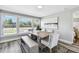 Bright dining room with large windows, gray walls and a modern table set at 6207 Gulfport S Blvd, Gulfport, FL 33707