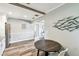 Dining area adjacent to kitchen and featuring gray walls and wooden table at 6207 Gulfport S Blvd, Gulfport, FL 33707