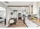 Beautiful kitchen with white cabinetry, stainless steel appliances, and a breakfast nook at 6207 Gulfport S Blvd, Gulfport, FL 33707