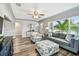 Comfortable living room showcasing hardwood floors, modern furniture, and ample natural light at 6207 Gulfport S Blvd, Gulfport, FL 33707