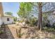 Exterior backyard showcasing the outdoor space, mature trees and lawn at 6333 Aberdeen Ave, New Port Richey, FL 34653