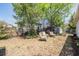 View of backyard with a seating area, wooden sheds and partial fence at 6333 Aberdeen Ave, New Port Richey, FL 34653
