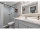 Bright bathroom with a shower, updated fixtures, and a sleek white vanity at 6333 Aberdeen Ave, New Port Richey, FL 34653