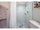 Updated bathroom featuring a tiled shower and modern fixtures at 6333 Aberdeen Ave, New Port Richey, FL 34653