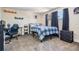 Cozy bedroom with sporty decor, and a comfortable bed at 6333 Aberdeen Ave, New Port Richey, FL 34653