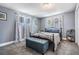 Bedroom with blue decor, carpet floors, and natural light from windows at 6333 Aberdeen Ave, New Port Richey, FL 34653
