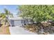 Single-story home with driveway and attached garage at 6333 Aberdeen Ave, New Port Richey, FL 34653