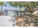 Charming single-story home with lush landscaping and attached garage at 6333 Aberdeen Ave, New Port Richey, FL 34653