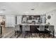 Kitchen features include stainless appliances, island seating, stone countertops, and dark cabinets at 6333 Aberdeen Ave, New Port Richey, FL 34653