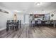 Spacious kitchen with an eat-in island and stainless appliances is adjacent to dining room at 6333 Aberdeen Ave, New Port Richey, FL 34653