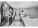 Modern kitchen featuring stainless steel appliances, sleek countertops, and ample cabinet space at 6333 Aberdeen Ave, New Port Richey, FL 34653