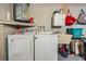 Functional laundry room with washer, dryer, and storage space at 6333 Aberdeen Ave, New Port Richey, FL 34653