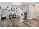 A modern living room with neutral walls and decor creating a spacious and inviting atmosphere at 6333 Aberdeen Ave, New Port Richey, FL 34653