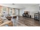 Spacious living room with modern flooring, neutral walls, and a large window for natural light at 6333 Aberdeen Ave, New Port Richey, FL 34653
