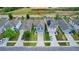 Aerial view of the house showing a well-kept lawn, proximity to other homes, and the surrounding area at 6648 Seaway Dr, Brooksville, FL 34604