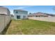 Spacious back yard, fully fenced for privacy, includes a swing set and patio seating area outside the home at 6648 Seaway Dr, Brooksville, FL 34604