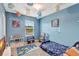Fun, playful bedroom featuring vibrant decor and a space-themed design at 6648 Seaway Dr, Brooksville, FL 34604