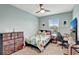Cozy bedroom with ample natural light, ceiling fan, and comfortable decor at 6648 Seaway Dr, Brooksville, FL 34604