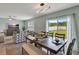 Open dining area adjacent to the living room with sliding glass doors and backyard views at 6648 Seaway Dr, Brooksville, FL 34604