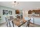 Stylish dining area with modern lighting fixture and open access to the kitchen at 6648 Seaway Dr, Brooksville, FL 34604