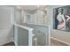 Upstairs hallway leading to bedrooms and bathrooms with neutral paint and carpet at 6648 Seaway Dr, Brooksville, FL 34604