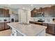 Expansive kitchen island with stainless sink, sleek appliances and cabinets in a modern kitchen at 6648 Seaway Dr, Brooksville, FL 34604