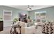 Bright living room featuring comfortable seating, large windows, and a cozy atmosphere at 6648 Seaway Dr, Brooksville, FL 34604