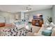 Inviting living room with a cozy fireplace, comfortable seating, and ample natural light at 6648 Seaway Dr, Brooksville, FL 34604