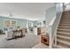 Open-concept living area with staircase and seamless flow to the dining and kitchen at 6648 Seaway Dr, Brooksville, FL 34604