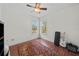 Bright and spacious bedroom with natural light, hardwood floors, and ample space for furniture at 6922 Duffy Ln, Tampa, FL 33616