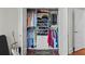 Spacious walk-in closet with custom organizers and rods to optimize space for clothing storage at 6922 Duffy Ln, Tampa, FL 33616
