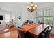 Bright dining room featuring a wooden table set with seating and natural lighting at 6922 Duffy Ln, Tampa, FL 33616
