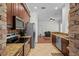 Modern kitchen featuring stainless steel appliances, granite countertops, and tile flooring at 6922 Duffy Ln, Tampa, FL 33616