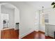 Bright laundry room with space for folding and storage, featuring wood floors at 6922 Duffy Ln, Tampa, FL 33616
